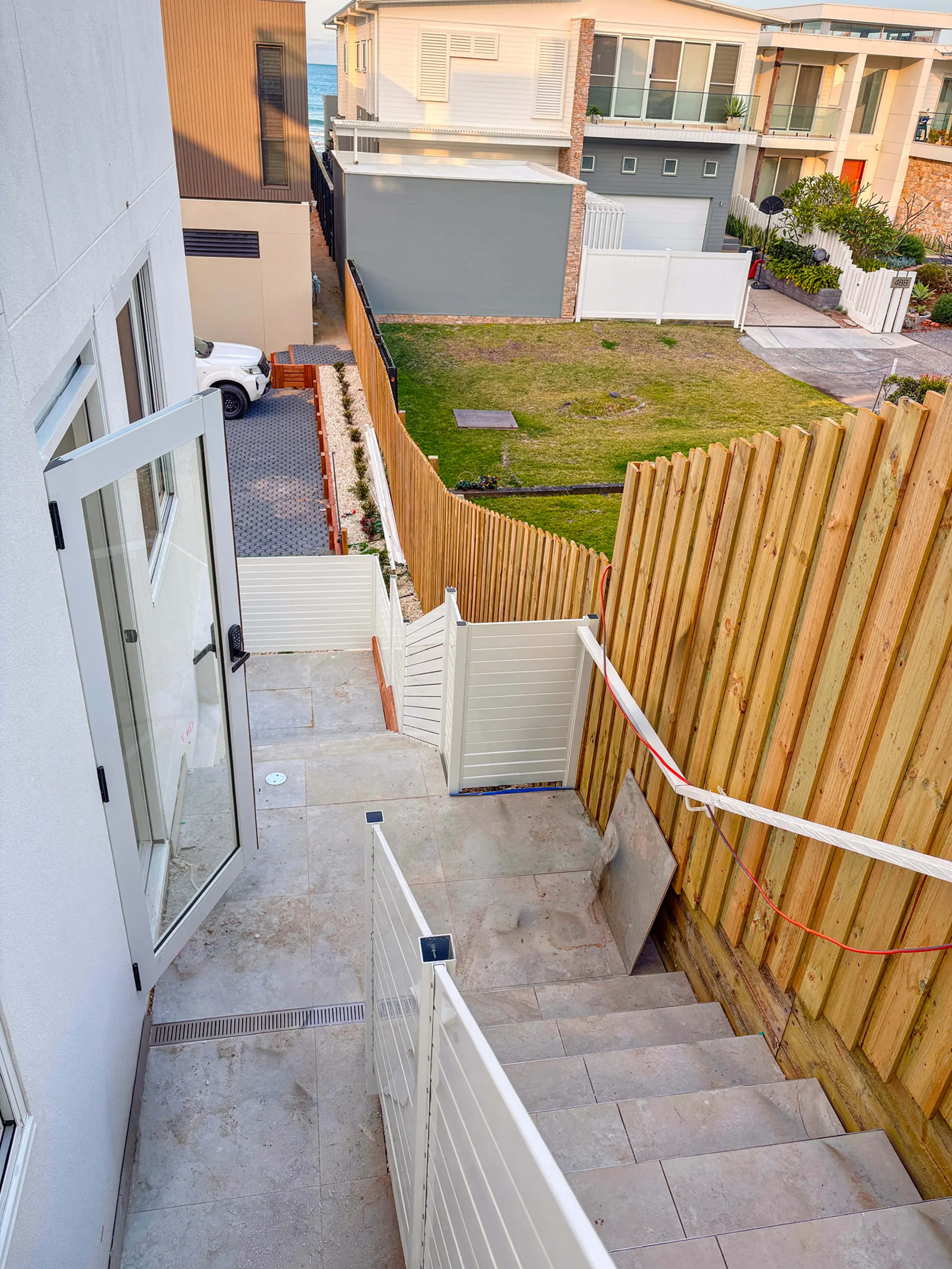 Outdoor stair handrail downward view.